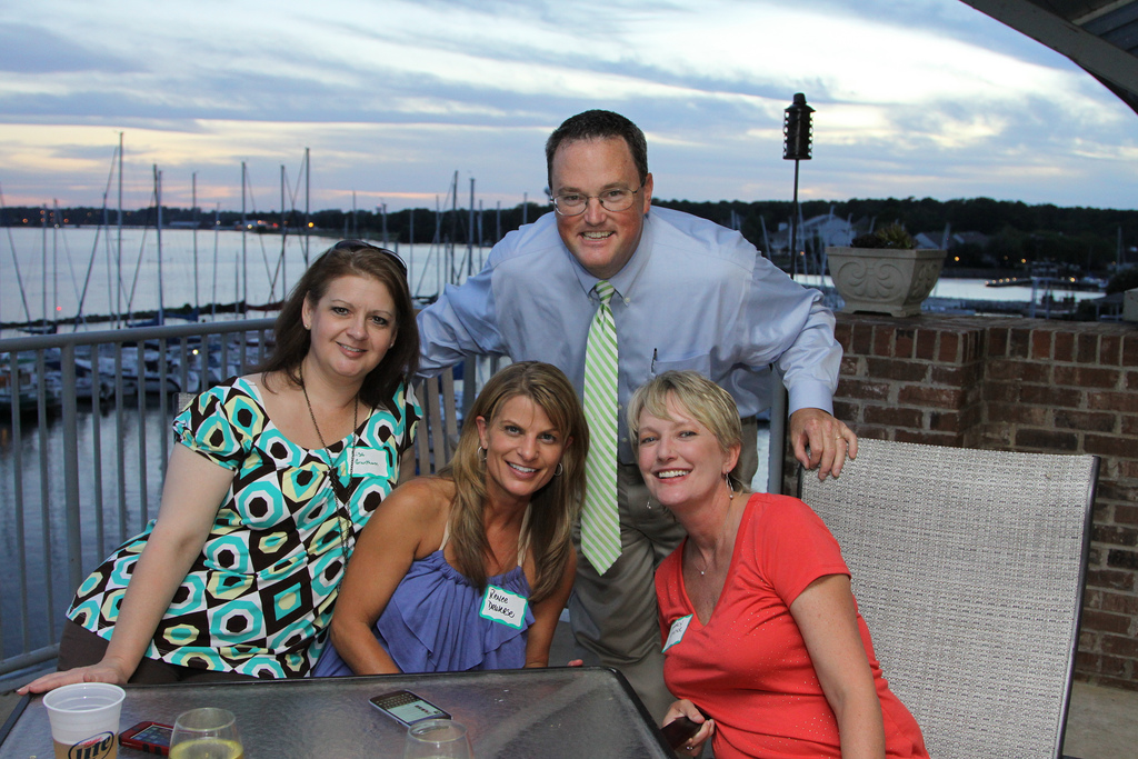 Photo Caption: Lisa Grantham, Renee Deweese, Marcy Cader, and Arthur Johnson, past president of the Alumni Association Board, attend chapter meeting at the Jackson Yacht Club. 